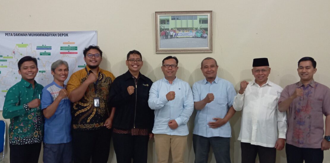 a group of men standing together and smiling